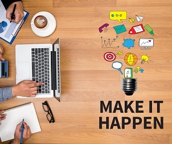 Image of people working on computer with icons and the words "Make it Happen"